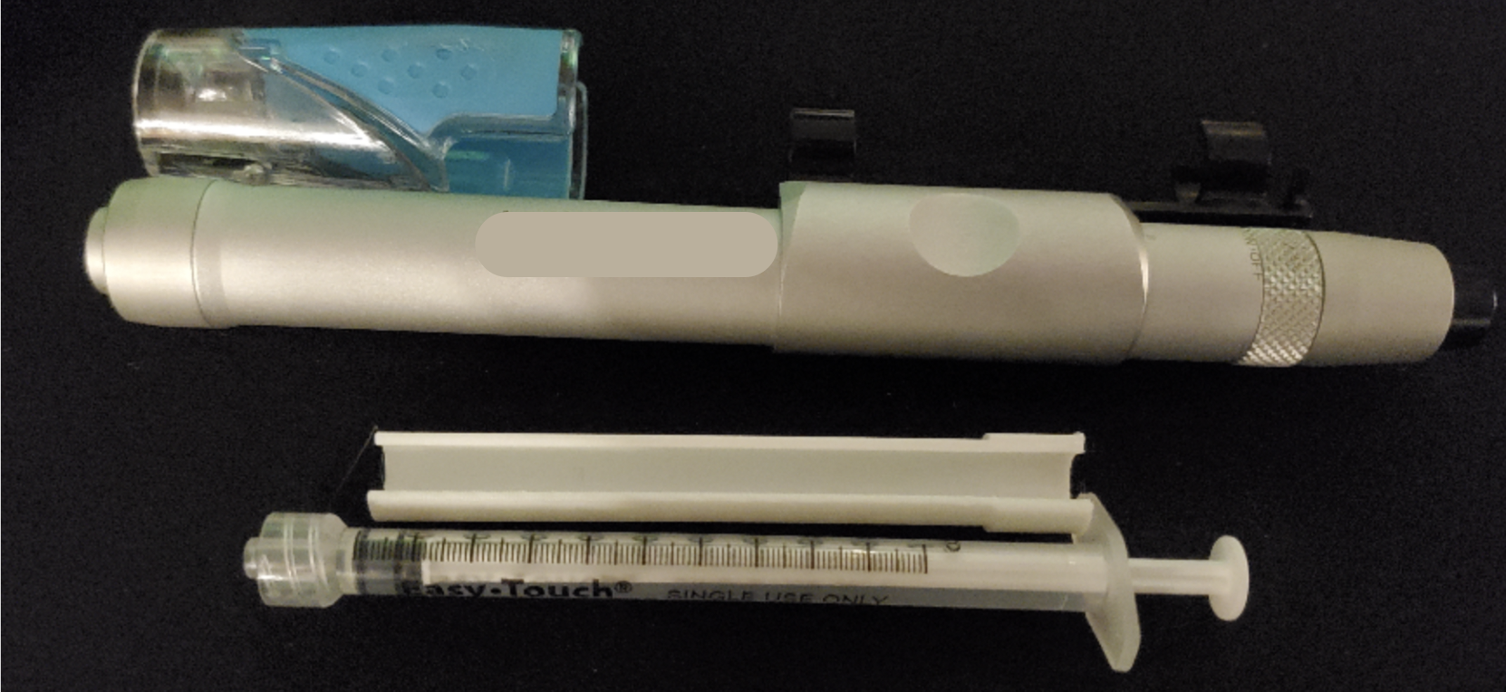 Amazon syringe, printed adapter, and autoinjector horizontally lined up